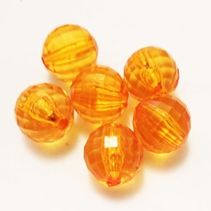 May include: Six faceted, orange-colored beads. Each bead has a round shape with a series of cut facets that create a textured surface. The beads are translucent, allowing light to pass through, and are suitable for jewelry making or craft projects.
