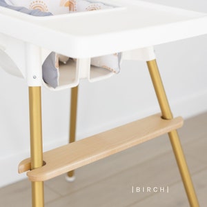 May include: A rustic wooden sign with the text "Welcome to our home" in white lettering. The sign features a distressed finish and a simple, inviting design, perfect for a front porch or entryway.