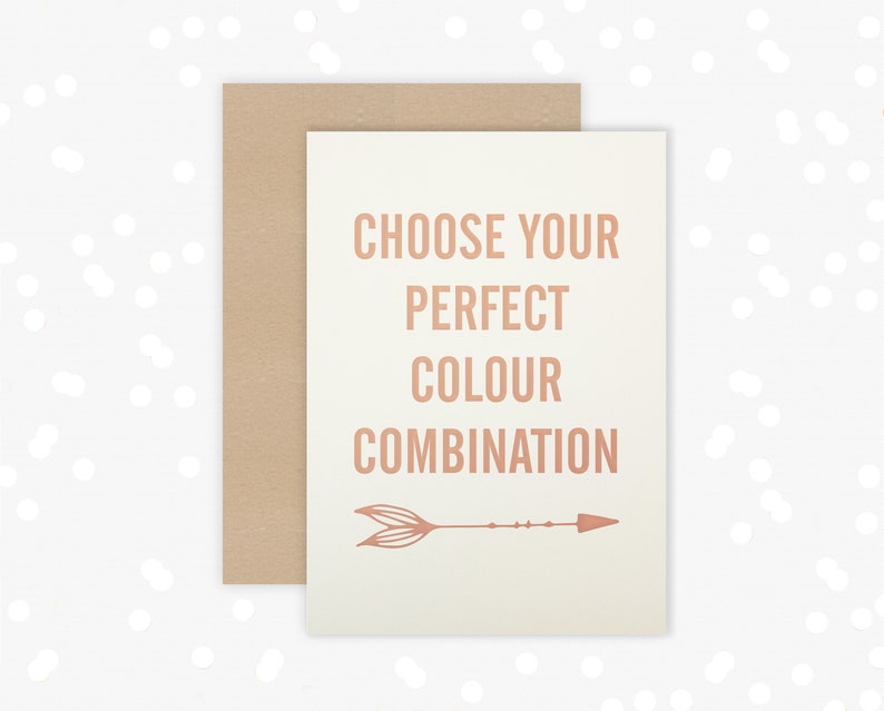 May include: A white card with the text "Choose your perfect colour combination" in a copper-colored font. An arrow with a feather design is below the text.