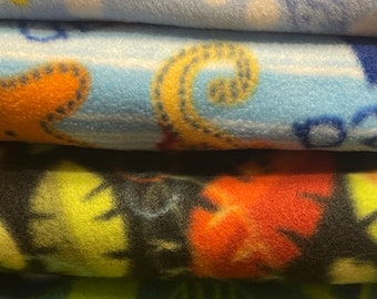 Fleece fabric stash, turtle and ocean animal prints.