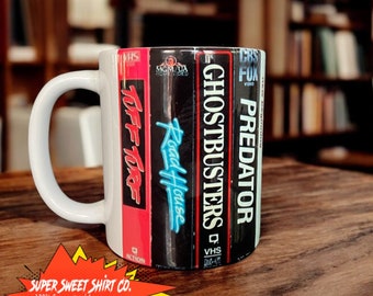 Retro 80s VHS Movie Coffee Mug - Vintage Film Reel Design - 11oz Ceramic Cup - Movie Lover Gift - Nostalgic Eighties Home Decor
