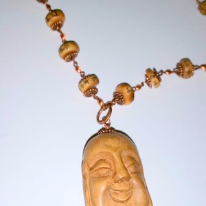 For the Love of      (Carved Buddha Head Necklace)