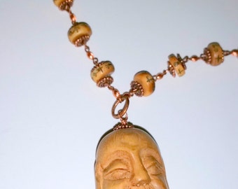 For the Love of      (Carved Buddha Head Necklace)