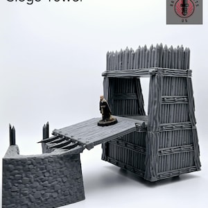 May include: A gray plastic siege tower model with a drawbridge and a wall section. The tower is made of wood planks and has a pointed roof. The drawbridge is lowered and a miniature figure is standing on it. The text "Siege Tower" is printed in black at the top of the image. The text "Wall not included" is printed at the bottom of the image.