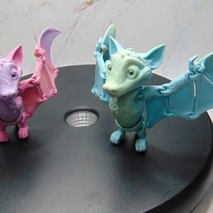 3D printed fruit bat with flapping wings and gripping feet
