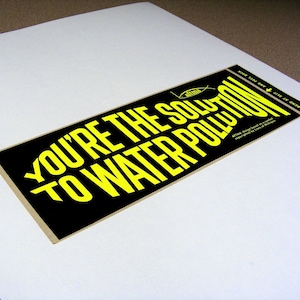 You're the solution to water pollution, vintage bumper sticker, day glo yellow, black, fish shaped text, fishing, water conservation image 1