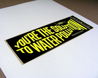 You're the solution to water pollution, vintage bumper sticker, day glo yellow, black, fish shaped text, fishing, water conservation