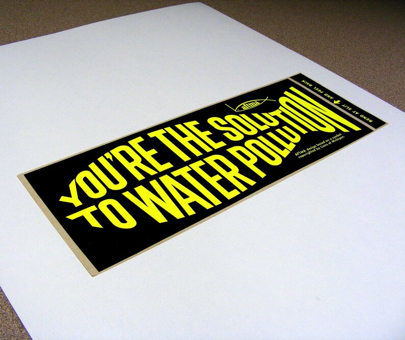 You're the solution to water pollution, vintage bumper sticker, day glo yellow, black, fish shaped text, fishing, water conservation image 1