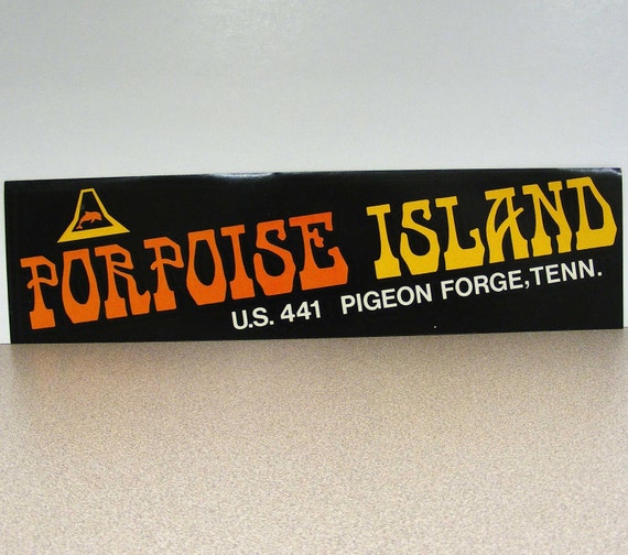 Porpoise Island Tennessee vintage bumper sticker dolphin sea creature polynesian tiki orange yellow black white Hawaiian amusement park