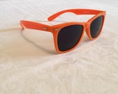 Orange vintage sunglasses, wayfarer style shades, plastic frame, dark lenses, sun eyewear, made in Taiwan, pizazz, james dean