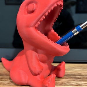 Dino pen holder