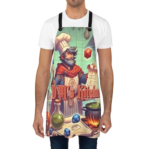 May include: A blue and red apron with a cartoon chef character wearing a white chef hat and holding a scroll. The apron has the text "DM's Kitchen" on it.