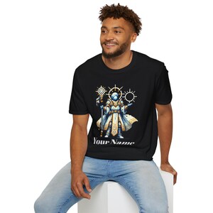 May include: A black t-shirt with a pixelated image of a wizard holding a staff and surrounded by glowing circles. The text "Your Name" is printed below the image.
