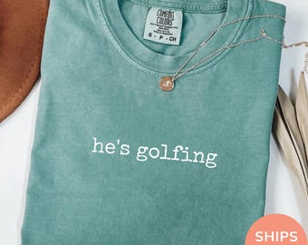 Comfort Colors® He's Golfing Shirt, Golfer Wife Shirt, Golf Girlfriend Shirt, Golf Season Tshirt, Golfing Mom Shirt, Golf Player Gift