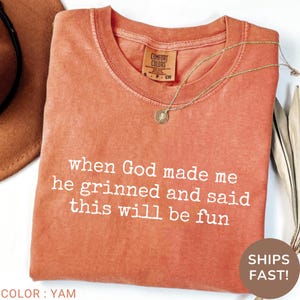 god’s sense of humor tee, uplifting funny shirt, faith crew tee, cute sarcastic shirt for women, god knew what he was doing shirt, religious joke shirt, lighthearted gospel tee, playful spirit tee, sunday morning shirt, casual church outfit, funny tee for christian mom, women’s church retreat tee, humorous religious apparel, god’s favorite t-shirt, joyful jesus tee, powerful faith tee, confident in christ tee, fun god quote shirt, bible humor tee, weekend faith shirt, clever faith shirt