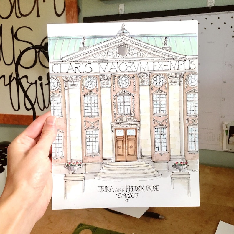 May include: A watercolor illustration of a building with a light brown facade and a green roof. The building has a large, double door entrance and several windows. The text above the entrance reads 'Claris Maiorum Exemplum.' Below the building is the text 'Erika and Fredrik Taube 15/9/2017 &.' 
