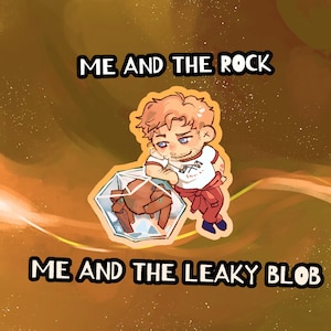 May include: A cartoon illustration features a character with red hair and a beard, leaning on a geometric shape containing a brown object. The text "ME AND THE ROCK" and "ME AND THE LEAKY BLOB" are displayed above and below the character.