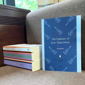 May include: A stack of three books titled "The Cadence of Part-Time Poets" with different colored spines. A fourth book with the same title is propped up, featuring a blue cover with guitar illustrations and the Penguin English Library logo.