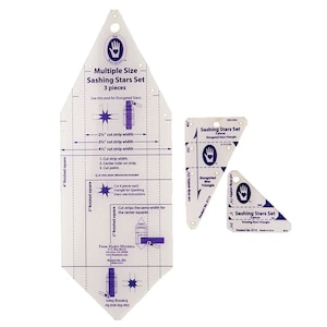 May include: A set of three clear plastic quilting templates for creating sashing stars. The templates include instructions and measurements for cutting strips from 2.5" to 4.5" wide. The set is designed for elongated stars and includes a triangle template.