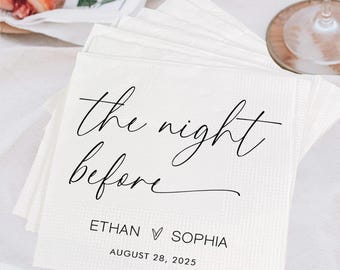 May include: White paper napkins with the text "the night before" in elegant script, along with the names Ethan and Sophia and the date August 28, 2025. The napkins are stacked on a white surface, with peaches, grapes, and wine glasses in the background.