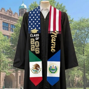 May include: A black graduation gown with a sash featuring the American flag, the Mexican flag, and the flag of El Salvador. The sash has the text "Name" in gold script and "Class of 2026".