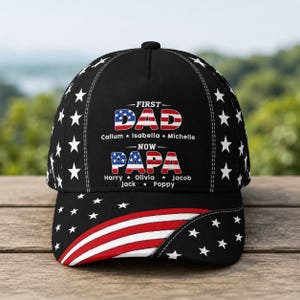 May include: Black baseball cap with white stars and a red, white, and blue American flag design. The cap features the text "FIRST DAD NOW PAPA" with names below. A stylish accessory for any dad.