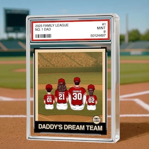 May include: A baseball card featuring a family of four in red jerseys with names and numbers. The card is encased in a clear protective holder. Text on the card reads "2025 Family League No. 1 Dad" and "Daddy's Dream Team."