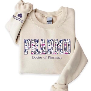 #PharmD #PharmacySweatshirt #DoctorOfPharmacy #PharmacyLife #PharmacistGift #PharmacySchool #PharmacyApparel #PharmacistLife #PharmacyCrewneck #HealthcareApparel #PharmacyStudent #PharmacyGraduation #MedicalSchoolGift #PharmDLife #PharmacyHoodie