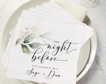 May include: White paper napkins with a floral design and the text "The night before Celebrating Sage + Dan". The napkins are arranged on a white plate, with a few napkins visible in the background.