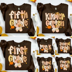 May include: Brown long-sleeve shirts with grade level designs. Each shirt features a grade level, such as "Fifth Grade", in a mix of patterns and colors, with a pumpkin and bow graphic. Perfect for back-to-school.