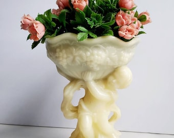 Vintage Plastic Cherub Vase with Plastic Rose Buds - Regaline?
