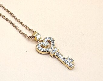 Collar con llave palestina pavimentada en oro