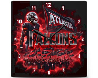 May include: A square wall clock featuring an Atlanta Falcons theme with a football player in a black uniform, a waving flag with the text ATLANTA, and the word FALCONS in large silver letters. The background is a vibrant red and black smoke effect.