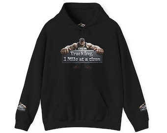 May include: A black hooded sweatshirt featuring a graphic on the chest and both sleeves. The graphic depicts a muscular figure holding a metallic sign that reads "Trucking, 1 Mile at a time" in white text. The hoodie has long sleeves and a hood.