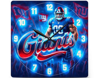 May include: A square wall clock featuring a New York Giants football player in a blue uniform, with the word Giants in large red and white script. The background shows a stadium crowd with blue lighting, and the clock face has white numbers.
