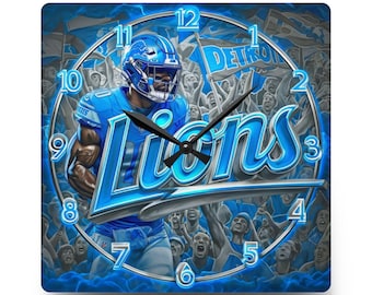 May include: A square wall clock featuring a Detroit Lions football player in a blue uniform and helmet, with the word Lions in large blue script, a crowd background, and black clock hands against a blue and grey colour scheme.