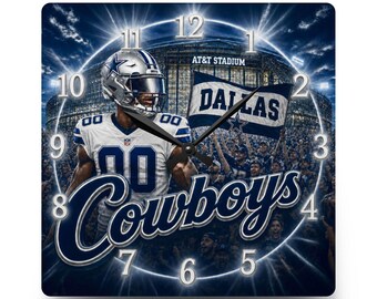 May include: A square wall clock featuring a Dallas Cowboys football player in a white jersey, a stadium background with the text AT&T STADIUM, a flag with the word DALLAS, and the word Cowboys in large script. The clock has black hands and white numbers.