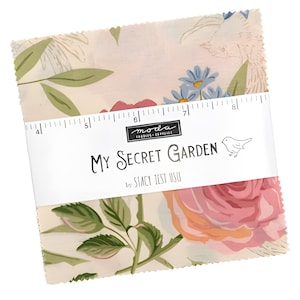 May include: A stack of fabric squares with a floral pattern featuring pink roses, blue flowers, and green leaves. The fabric is wrapped with a white band that reads "My Secret Garden" by Stacy Iest Hsu.
