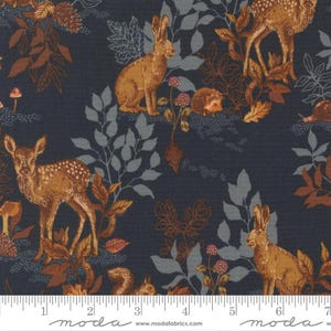 May include: Dark blue fabric with a woodland scene featuring deer, rabbits, and a hedgehog. The design includes brown and gray leaves, mushrooms, and flowers. The fabric has a repeating pattern with a ruler along the bottom.