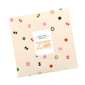 May include: Cream fabric featuring a repeating pattern of colourful floral and geometric shapes. A white label in the centre reads "RUBY STAR SOCIETY" and "1-800-NOTION" with a graphic of a sewing tool.