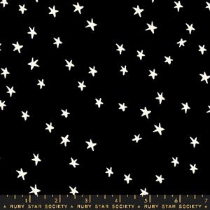 May include: Black fabric with a scattered pattern of off-white stars. The stars vary in size and are evenly distributed across the dark background. The fabric has a celestial or night sky theme.