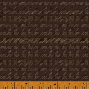 May include: Brown fabric with a plaid pattern. The pattern features a grid of squares and diagonal lines in a lighter shade of brown. A wooden ruler with inch markings is at the bottom.