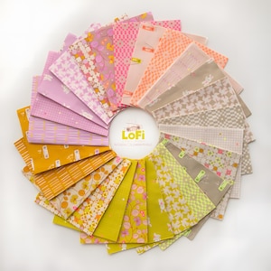 May include: A circular arrangement of fabric squares in various pastel colors, including pink, yellow, and green. Each square features a unique pattern, such as floral designs, geometric shapes, and small illustrations. The center circle has the word "LoFi" and the name "MICHOA COLEMAN HALE".