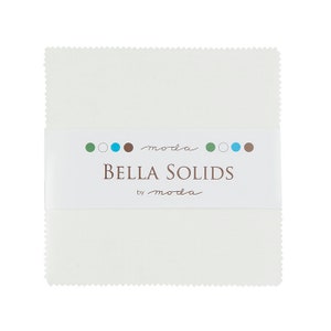 May include: A white fabric square with a label that reads "moda Bella Solids by moda" with a row of colored circles above the text.
