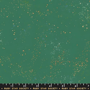 May include: Green fabric with a speckled pattern. The fabric has a dark green background with small, scattered specks of orange, white, and blue. The text "RUBY STAR SOCIETY" is at the bottom.