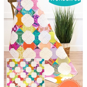 May include: A colorful quilt with a bow tie pattern, featuring various fabric patterns and colors. The quilt is draped over a chair. The text "Curvy Bow Tie" and "Sew Kind of Wonderful" are visible.