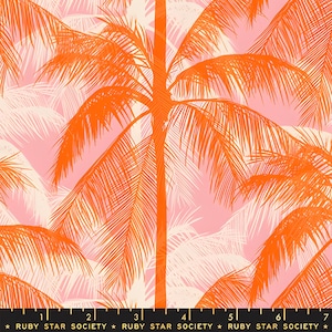 May include: A fabric print featuring a repeating pattern of vibrant orange palm trees set against a soft pink background. A black ruler at the bottom shows measurements from 1 to 7 inches, with the text RUBY STAR SOCIETY printed repeatedly.
