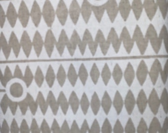 May include: A white and gray patterned fabric with a repeating diamond pattern. The fabric has a subtle texture and a white circle with a white outline in the center.