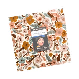 May include: A square fabric piece with a floral pattern in shades of peach, brown, teal, and gold. The fabric is adorned with a variety of flowers and leaves. A tag with the text "Feather & Forest Blooms" and a woman's portrait is attached.