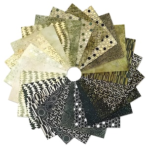 May include: A circular arrangement of fabric swatches in various shades of green, beige, and black. Each triangular piece displays a unique pattern, including geometric shapes, dots, and organic designs. The swatches are arranged around a central white circle.